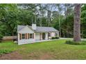Charming renovated cottage with beautiful lawn, trees and updated features at 232 Apple Branch Dr, Woodstock, GA 30188