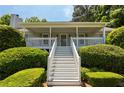 Eye-level view of home's front porch with white stairs, columns and trim at 6275 Cheatham Lake Nw Dr, Acworth, GA 30101