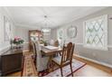 Formal dining room with elegant decor, hardwood floors, and a chandelier for memorable gatherings at 4205 Jeri Lynn Ct, Tucker, GA 30084