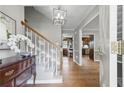 Inviting entryway with hardwood floors, a staircase, and elegant decor, creating a warm ambiance at 4205 Jeri Lynn Ct, Tucker, GA 30084