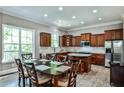 Spacious kitchen with wood cabinets, granite countertops, a kitchen island and a large window with natural light at 1249 Francis Nw St, Atlanta, GA 30318