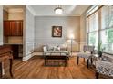 Elegant living room featuring hardwood floors, a neutral color scheme, and wainscoting detail throughout the room at 1249 Francis Nw St, Atlanta, GA 30318