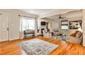 Open living room featuring hardwood floors, fireplace, built-in bookshelves, and comfortable seating at 1082 Greenbriar Cir, Decatur, GA 30033
