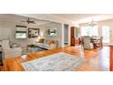 Open floor plan that includes a living area and a dining area with hardwood floors throughout at 1082 Greenbriar Cir, Decatur, GA 30033