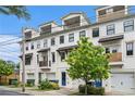 Townhomes with pristine white exteriors, welcoming upper-level balconies, and convenient single-car garages at 1192 Wylie Se St # 429, Atlanta, GA 30316