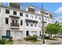 Charming townhomes featuring clean white exteriors, upper-level decks, and convenient garage entrances at 1192 Wylie Se St # 429, Atlanta, GA 30316