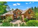 Charming brick home with manicured landscaping and a paver driveway at 5765 Riley Rd, Cumming, GA 30028