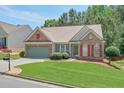 Beautiful home with well-kept lawn and mature landscaping features, offering great curb appeal at 935 Santa Anita Dr, Woodstock, GA 30189