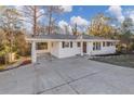 Charming single-story home with a manicured front yard and long driveway at 2480 Miriam Ln, Decatur, GA 30032