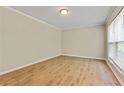 Bright bedroom featuring neutral walls and modern vinyl flooring at 4639 Tell Sw Rd, Atlanta, GA 30331