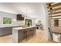 Bright, modern kitchen with a large island, stainless steel appliances, and stylish pendant lighting fixtures at 1327 Harvard Ne Rd, Atlanta, GA 30306