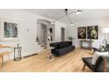 Bright living room with modern lighting, hardwood floors, neutral walls and stylish contemporary decor at 1327 Harvard Ne Rd, Atlanta, GA 30306