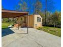 Home featuring covered parking area and well maintained lawn at 3082 Dove Way, Decatur, GA 30033