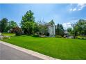 Side view of a beautiful house sitting on a sprawling lush green lawn at 1130 S Rudder Rd, Cumming, GA 30041