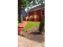 Inviting front yard with a red walkway leading to the entrance of the home at 1105 Oak Knoll Ter, Atlanta, GA 30315