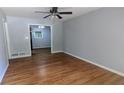 Bright living room showcasing hardwood floors and neutral paint tones at 2569 Dobbs Nw Dr, Kennesaw, GA 30152