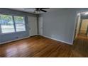 Living room with hardwood floors, neutral paint, and ample natural light at 2569 Dobbs Nw Dr, Kennesaw, GA 30152
