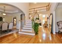 Bright foyer with hardwood floors and a staircase leading to the second floor at 6765 Crofton Dr, Alpharetta, GA 30005