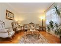 Elegant living room featuring ornate furniture and a decorative rug at 6765 Crofton Dr, Alpharetta, GA 30005