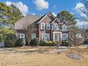 Charming brick two-story home with manicured lawn and mature trees at 101 Lumby Ln, Stockbridge, GA 30281