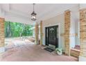 Inviting front porch with brick columns and decorative accents, leading to the front door at 379 Bohannon Rd, Grantville, GA 30220