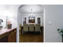 Bright dining room featuring a chandelier, hardwood floors, and a large table with seating at 1146 Cumberland Ne Rd, Atlanta, GA 30306