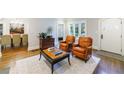 Inviting living room featuring hardwood floors, comfortable seating, and bright natural light at 1146 Cumberland Ne Rd, Atlanta, GA 30306