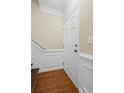 Entryway with hardwood floors, white trim, and a white door at 5159 Wellsley Bnd, Alpharetta, GA 30005