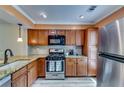Modern kitchen with stainless steel appliances, granite countertops, and stylish cabinetry at 2972 Aspen Woods Entry, Atlanta, GA 30360