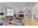 Inviting living room with built-in shelves, fireplace, and hardwood floors at 4901 Briarleigh Chase Sw, Mableton, GA 30126