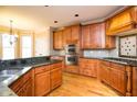 Well-equipped kitchen featuring granite countertops, stainless steel appliances, and ample cabinet space at 237 Libby Ln, Canton, GA 30115