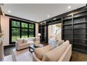 Stylish living room featuring built-in bookshelves and a large window at 3773 Randall Se Rd, Atlanta, GA 30339
