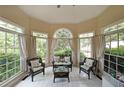 Bright sun room with decorative tile flooring and lots of natural light at 5617 Asheforde Ln, Marietta, GA 30068