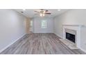 Spacious living room with fireplace and hardwood flooring at 1406 Windy Ridge Se Ct, Conyers, GA 30013