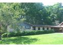 Charming brick home featuring a well-manicured lawn and a convenient carport at 4747 Darlene Way, Tucker, GA 30084