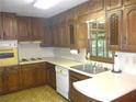 Traditional kitchen featuring ample wood cabinets and a bright window view at 4747 Darlene Way, Tucker, GA 30084