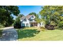 Beautiful home showcasing a well-manicured lawn and inviting curb appeal at 160 Isleworth Way, Fayetteville, GA 30215