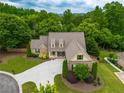 Spacious suburban home with lush landscaping, mature trees, and charming curb appeal at 200 Glenview Ct, Woodstock, GA 30188