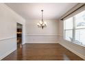 Light-filled dining room with hardwood floors and decorative lighting at 200 Glenview Ct, Woodstock, GA 30188