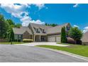 Beautiful home with an attached two-car garage, manicured landscaping and a circular driveway at 200 Glenview Ct, Woodstock, GA 30188