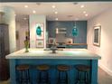 Modern kitchen featuring a large island with seating, sleek cabinets, and pendant lighting, perfect for entertaining at 845 Spring Nw St # 129, Atlanta, GA 30308