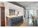 Open-concept kitchen featuring a large island with seating, stainless steel appliances, and bright, airy design at 845 Spring Nw St # 129, Atlanta, GA 30308