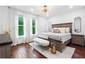 Bright and airy bedroom with hardwood floors, large windows, stylish lighting, and modern furniture at 1802 Dekalb Ne Ave, Atlanta, GA 30307