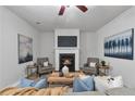 A living room featuring a fireplace, stylish decor, and comfortable seating arrangement at 2735 Maple Park Pl # 32, Cumming, GA 30041