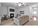 Inviting living room with a cozy fireplace, neutral tones, and ample seating at 2735 Maple Park Pl # 32, Cumming, GA 30041
