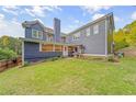 Expansive backyard with lush green lawn and well-manicured landscaping at 321 River Green Ave, Canton, GA 30114