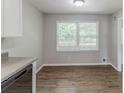 Dining area with a large window and wood-look floors at 3120 Westwood Dr, Acworth, GA 30102