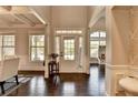 Bright foyer with hardwood floors and white trim, offering a welcoming entrance to the home at 7470 Oldbury Pl, Cumming, GA 30040