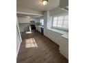 Well-lit kitchen featuring white cabinets and modern appliances at 888 Beecher Sw Ct, Atlanta, GA 30311
