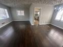 Bright living room featuring beautiful hardwood floors and natural light at 888 Beecher Sw Ct, Atlanta, GA 30311